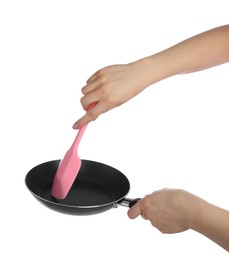 Photo of Woman with spatula and frying pan on white background, closeup