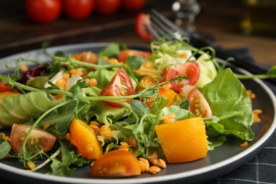 Photo of Delicious salad with lentils and vegetables served on table, closeup