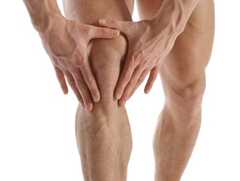 Man with muscular legs on white background, closeup