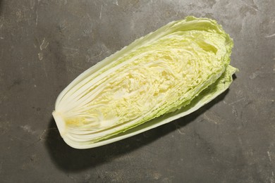 Fresh ripe Chinese cabbage on gray textured table, top view