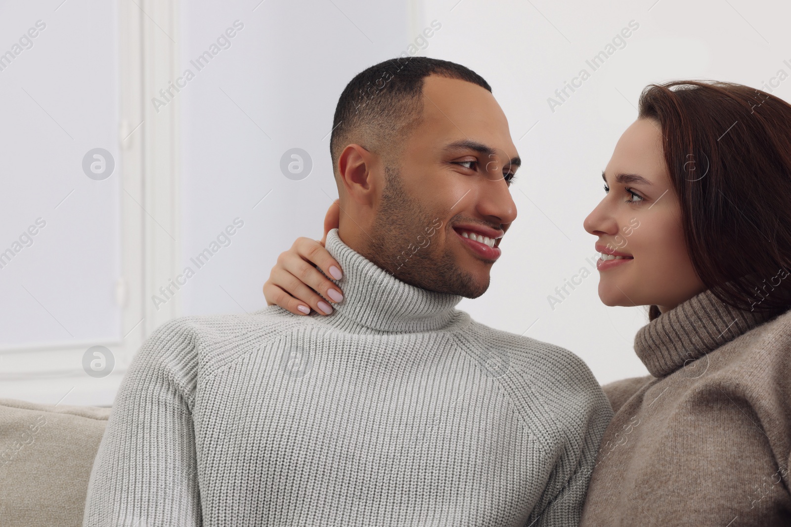 Photo of Dating agency. Happy couple enjoying time together at home