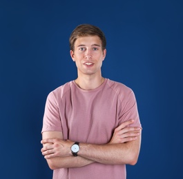 Portrait of handsome man on color background