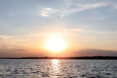 Photo of Picturesque view of beautiful sunrise on riverside. Morning sky