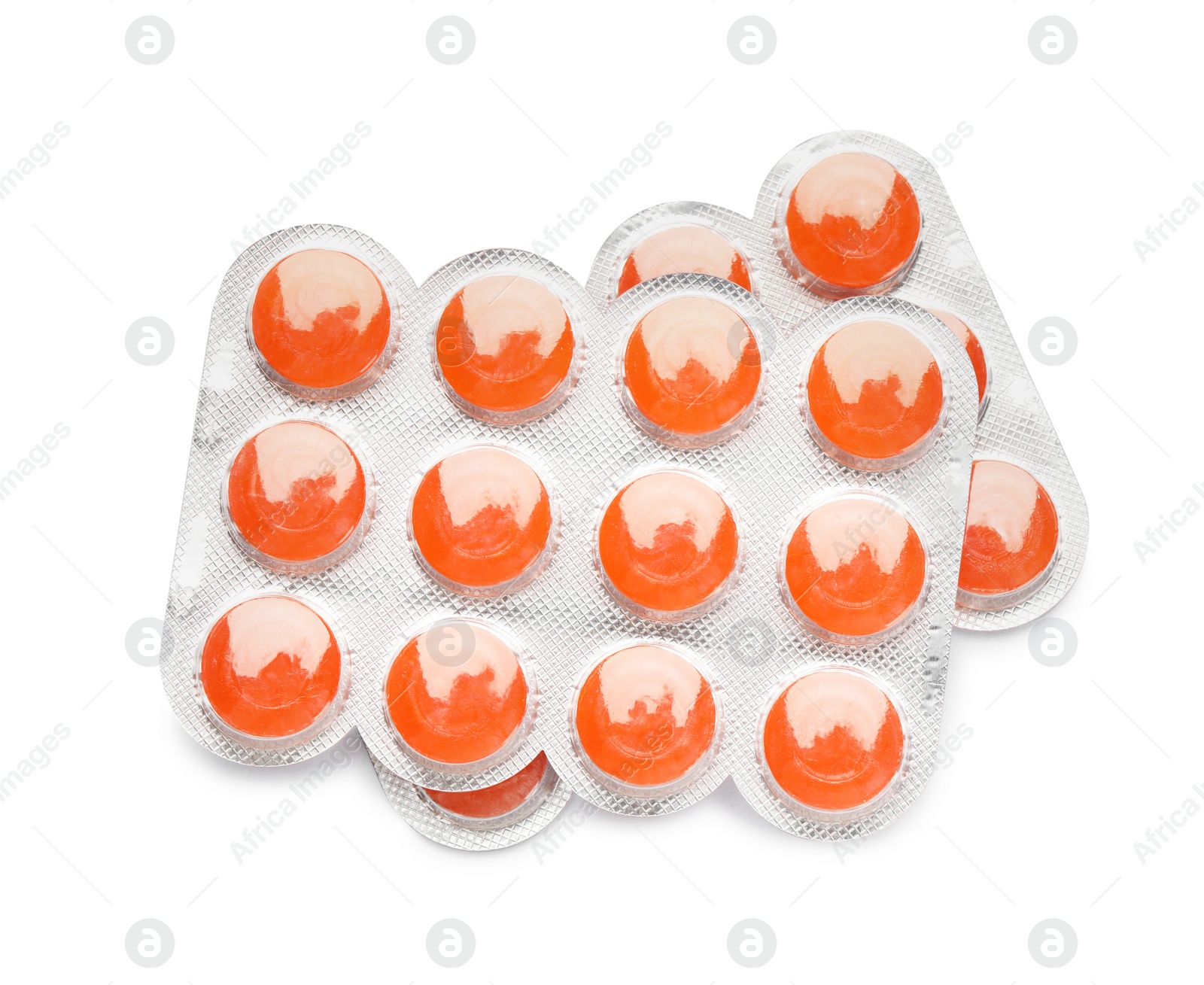 Photo of Blisters with orange cough drops on white background, top view