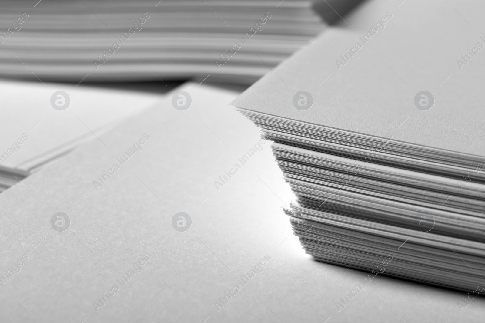 Photo of Stacks of paper sheets as background, closeup