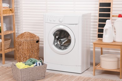 Laundry room interior with washing machine and baskets
