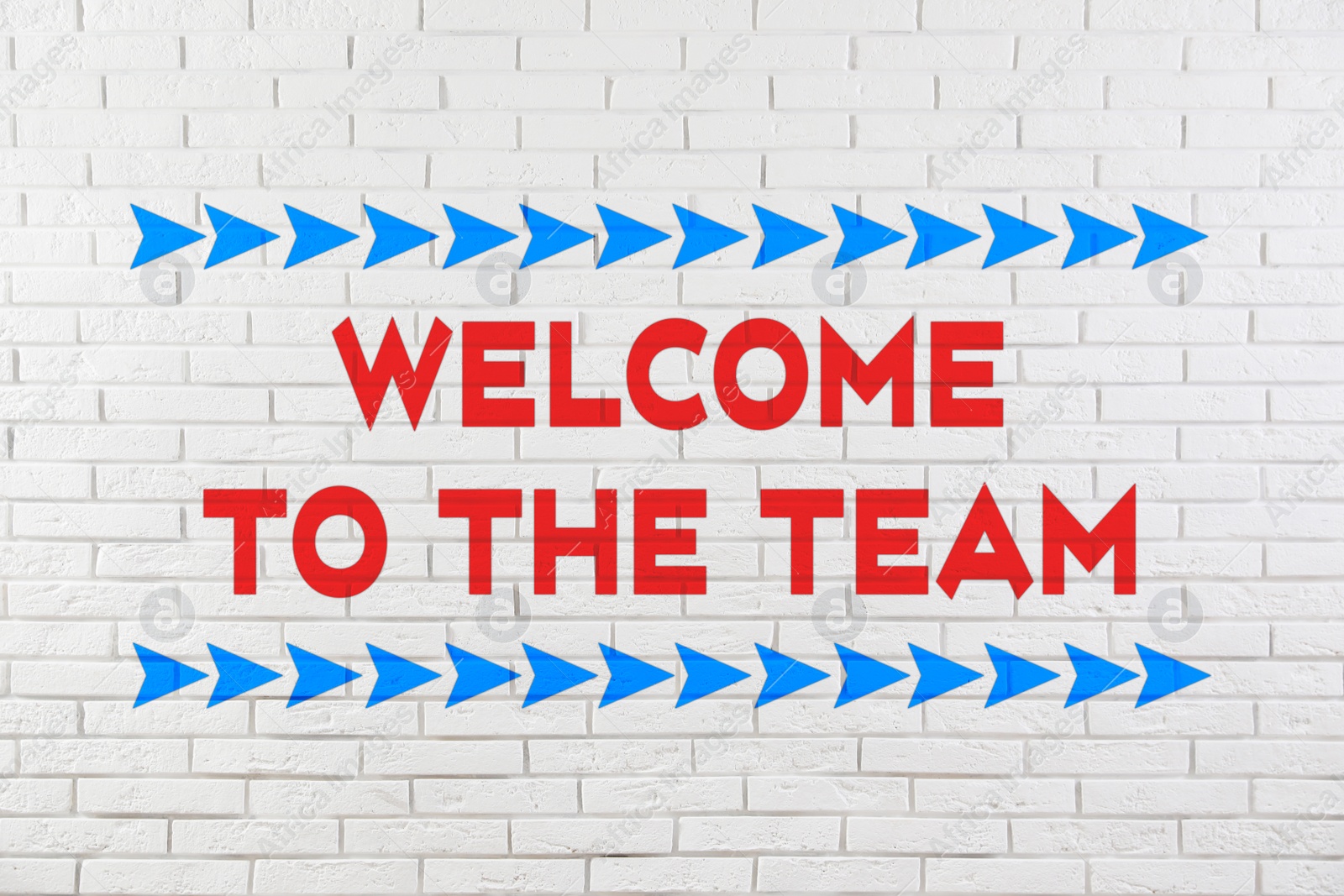 Image of Phrase Welcome to the team on white brick wall 