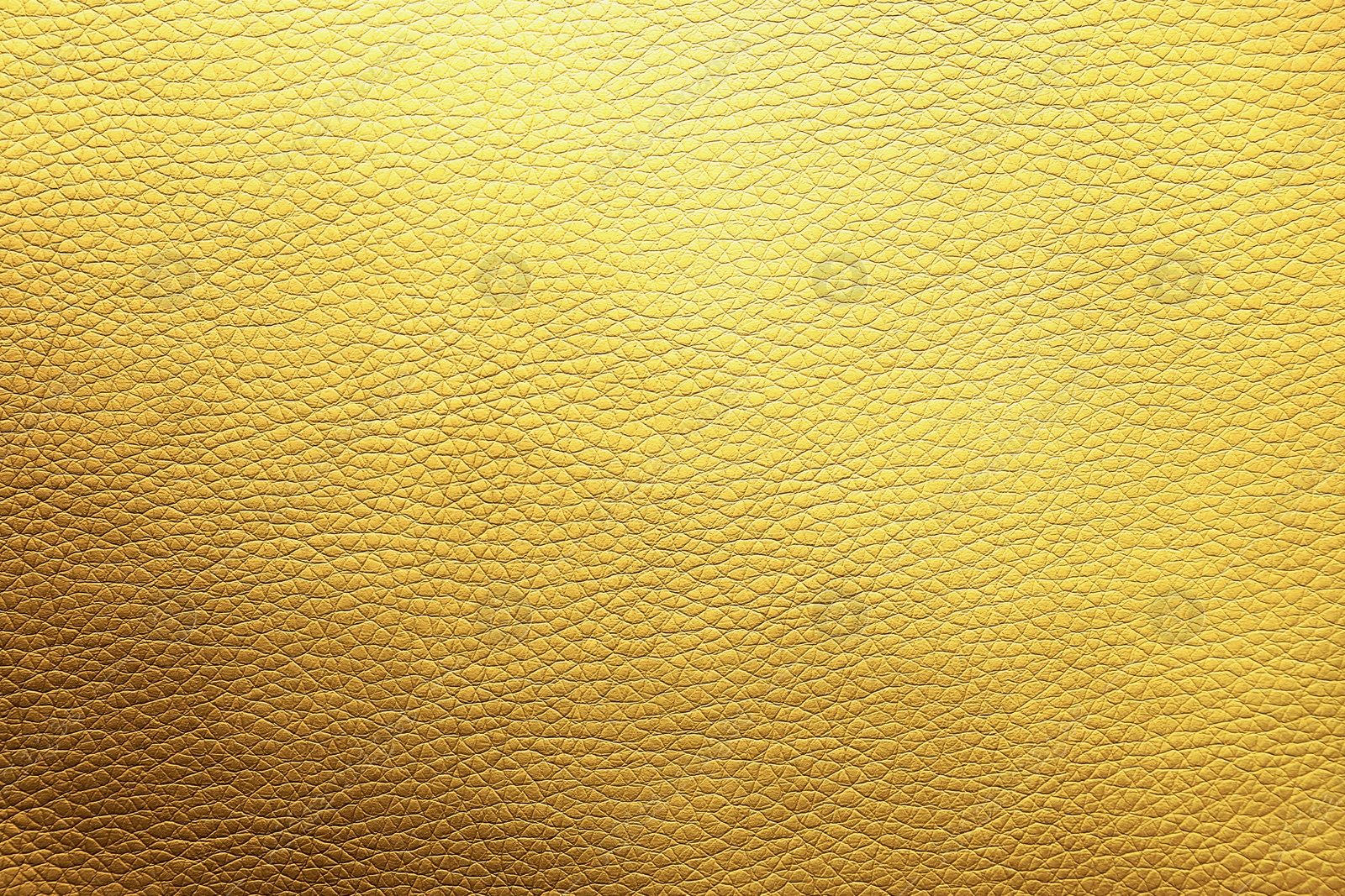 Image of Golden textured surface as background, closeup view