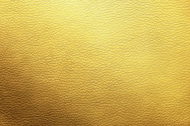 Image of Golden textured surface as background, closeup view