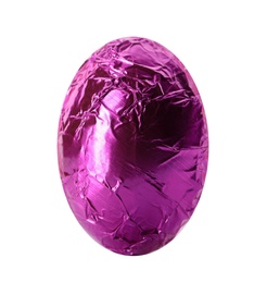 Chocolate egg wrapped in bright purple foil isolated on white