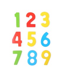 Colorful numbers on white background, top view