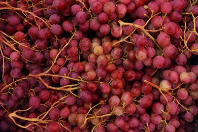 Photo of Fresh ripe grapes as background, top view