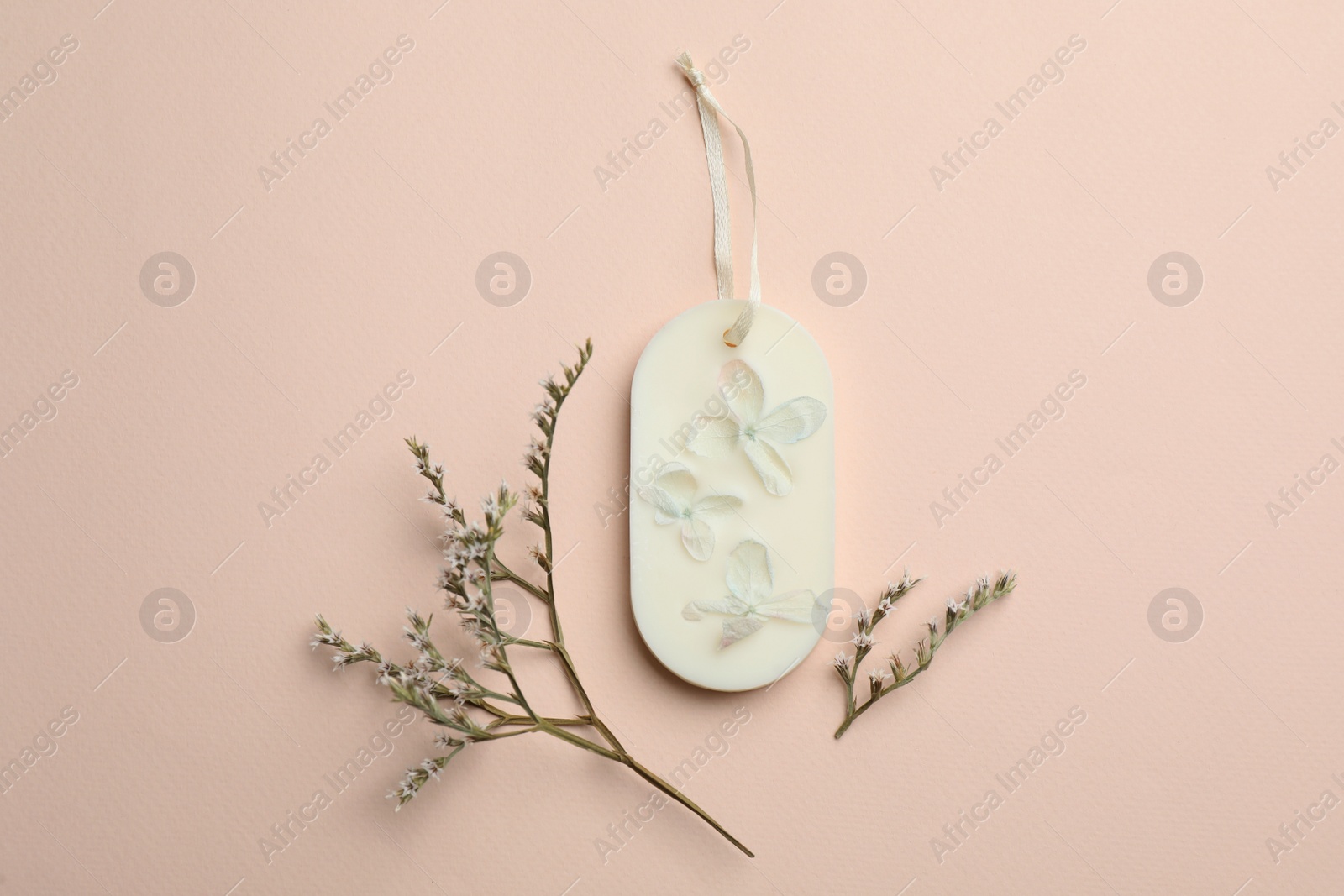 Photo of Flat lay composition with scented sachets on pink background