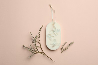 Flat lay composition with scented sachets on pink background