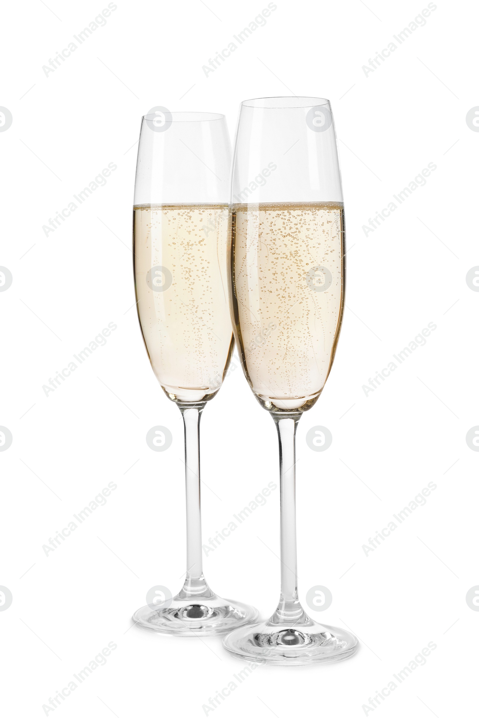 Photo of Glasses of champagne on white background. Festive drink