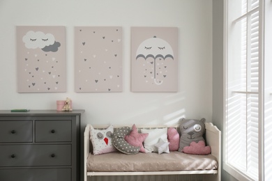 Baby room interior with cute posters and comfortable bed