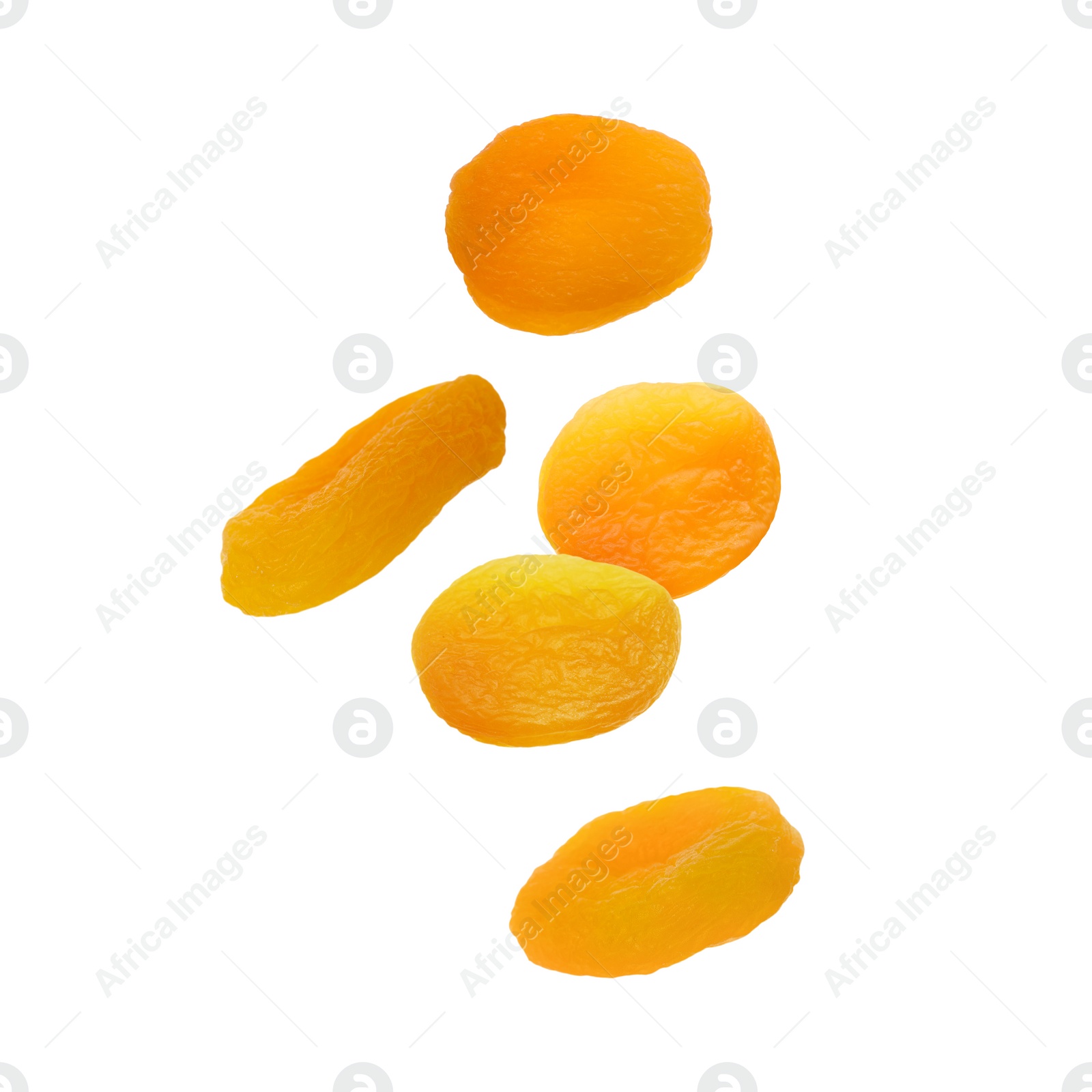 Image of Many tasty dried apricots on white background