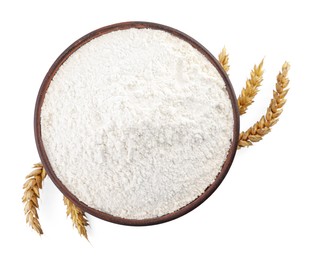 Bowl with wheat flour and spikelets on white background, top view