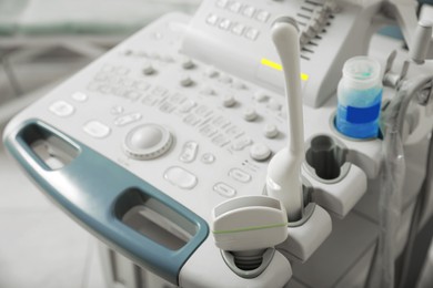 Photo of Ultrasound control panel with ultrasonic transducers indoors, closeup. Medical equipment