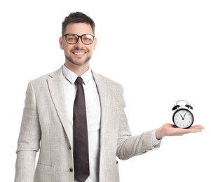 Photo of Happy businessman holding alarm clock on white background. Time management