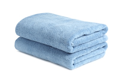 Photo of Folded clean soft towels on white background