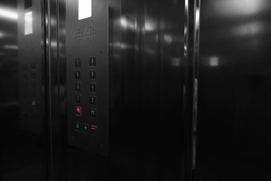 Photo of Modern metallic elevator with call button panel