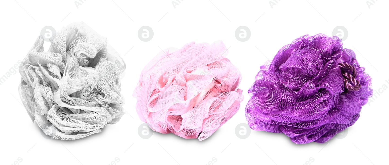 Photo of New shower puffs on white background. Personal hygiene