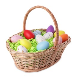 Wicker basket with beautifully painted Easter eggs isolated on white