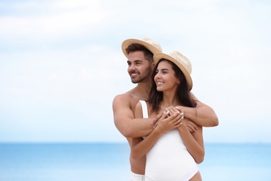 Happy young couple spending time together on beach