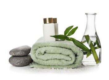 Photo of Composition with fresh bamboo, cosmetic products and spa stones on white background