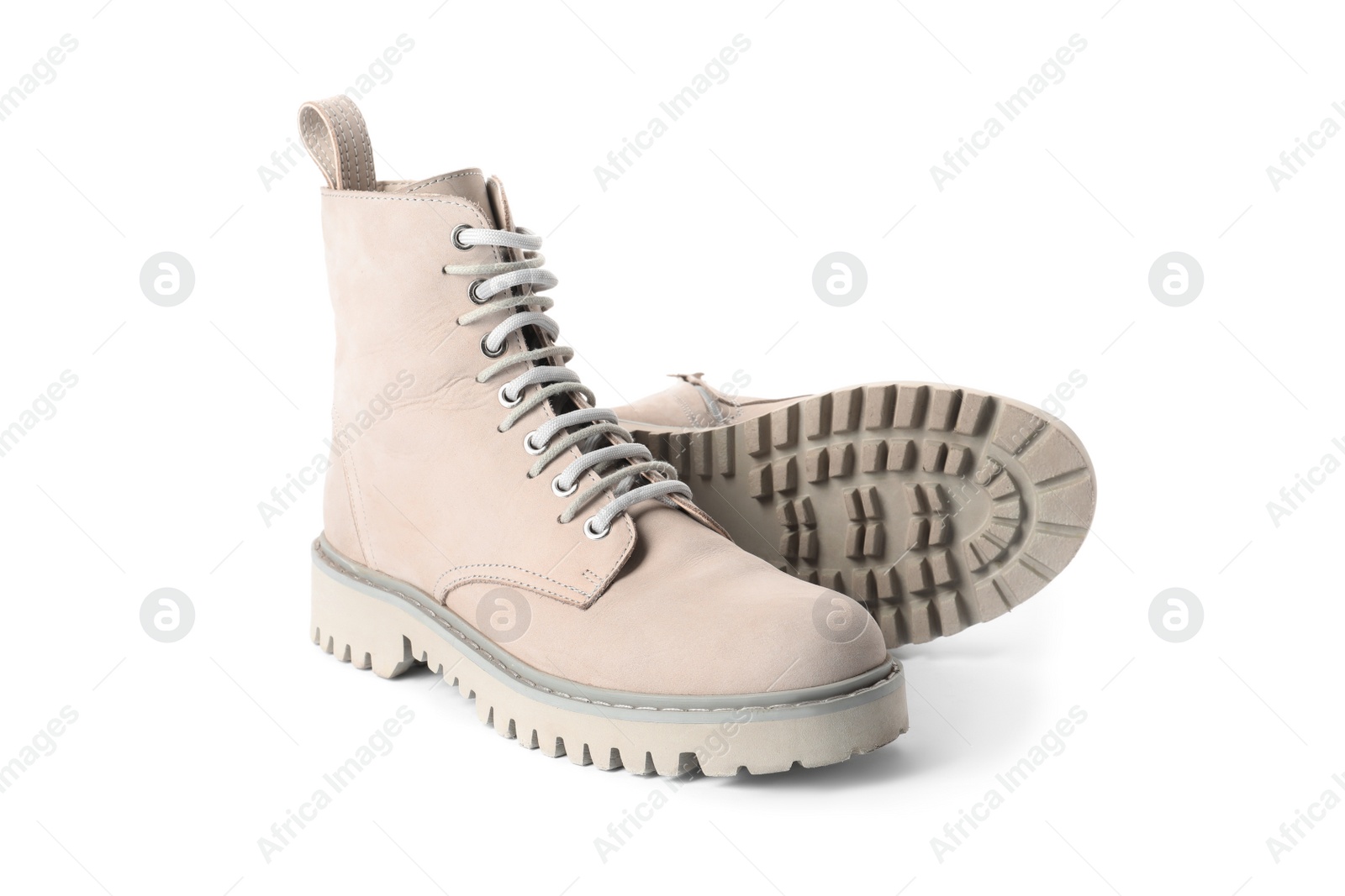 Photo of Pair of stylish boots on white background