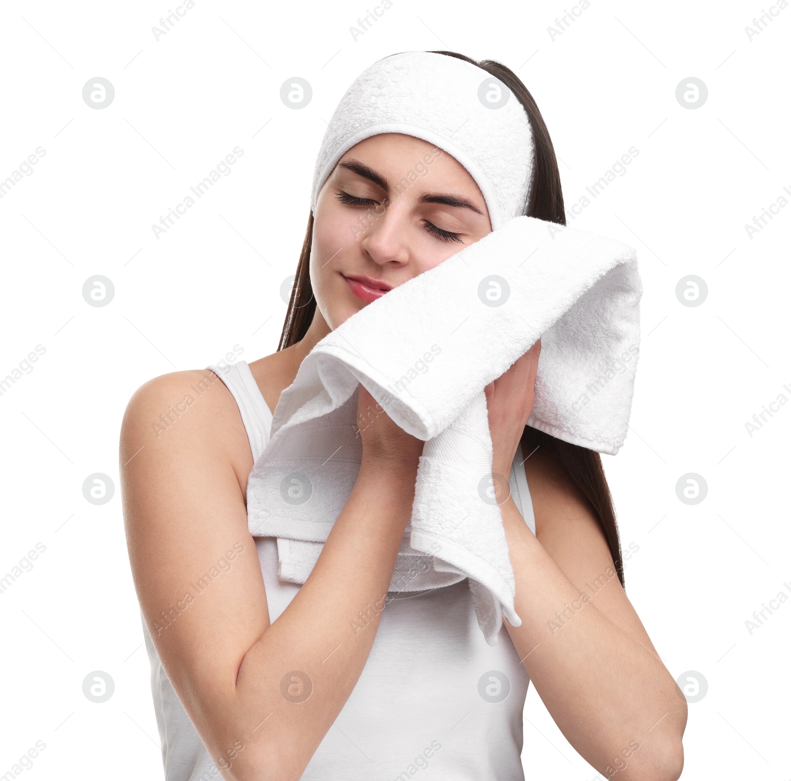 Photo of Washing face. Young woman with headband and towel on white background