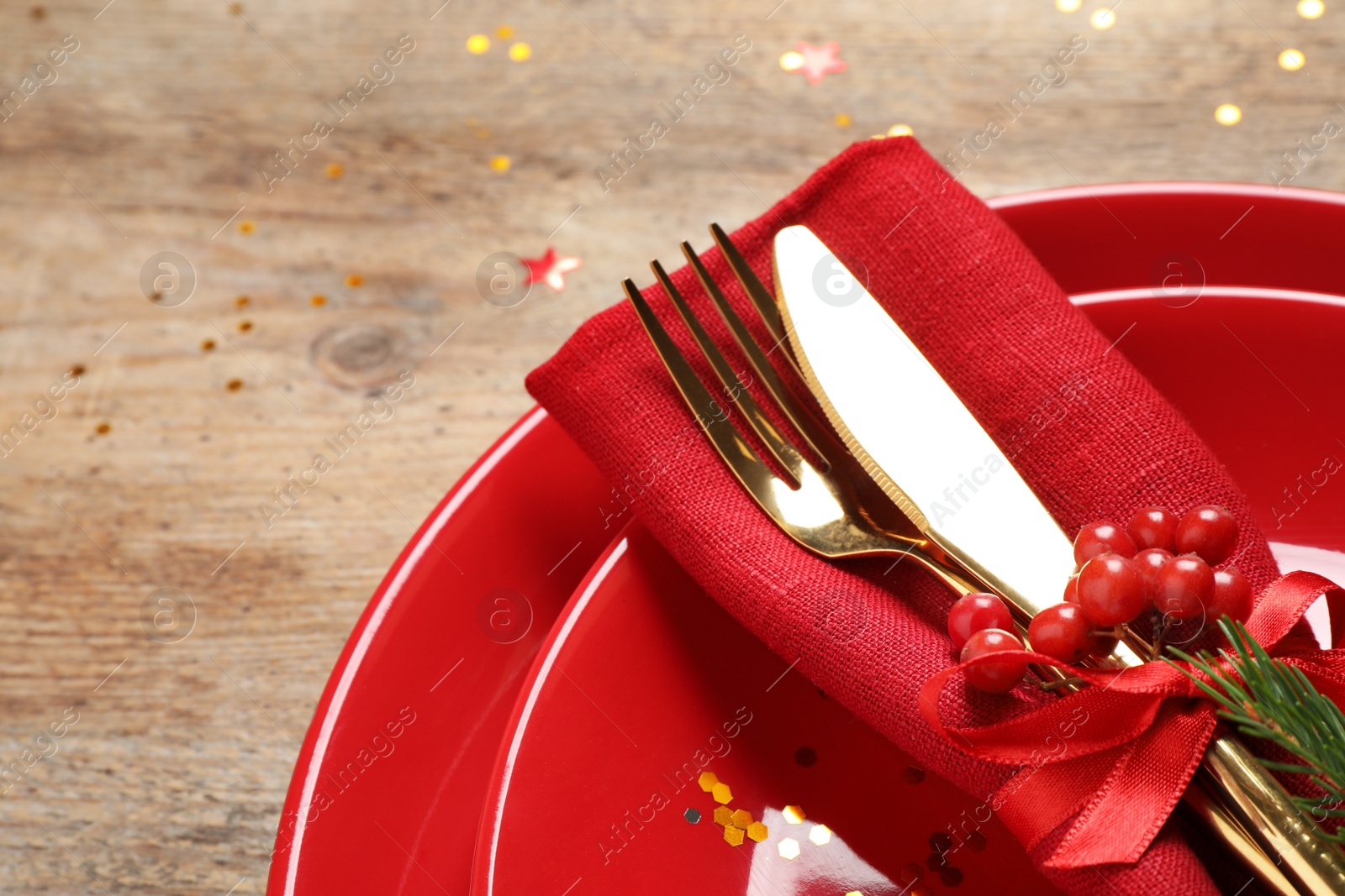 Photo of Beautiful Christmas table setting on wooden background, closeup