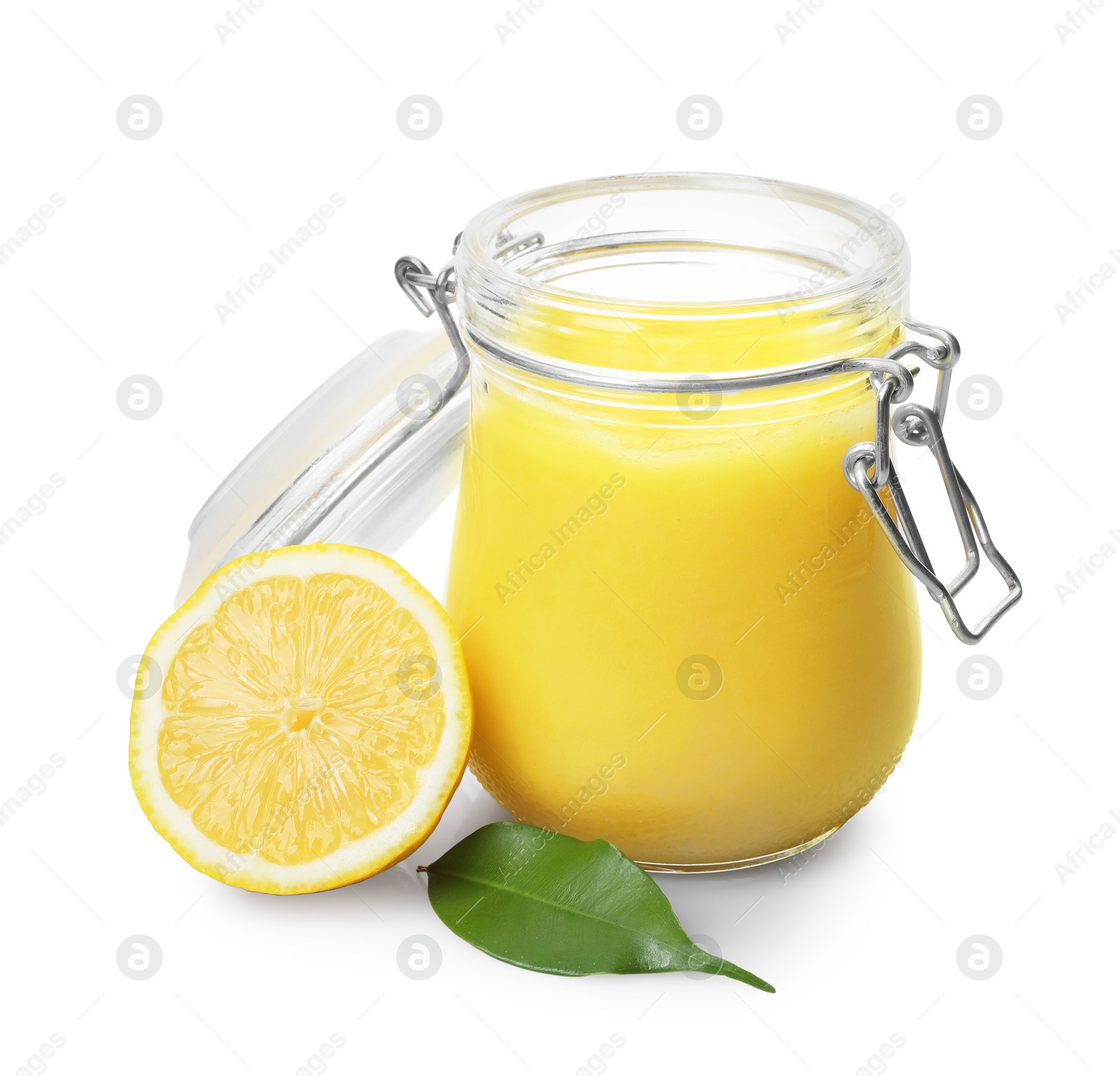 Photo of Delicious lemon curd in glass jar, fresh citrus fruit and green leaf isolated on white