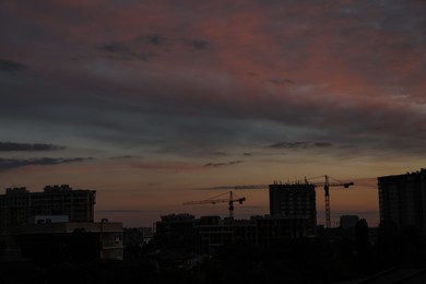 Photo of Beautiful sky with clouds over city in evening