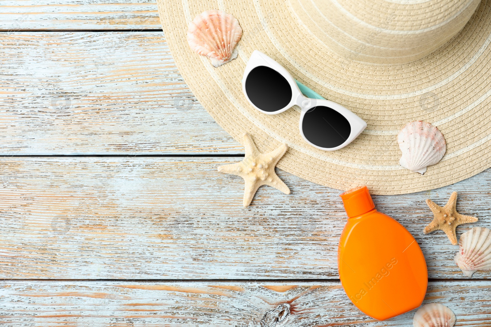 Photo of Beach objects and space for text on wooden background, flat lay