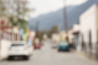 San Pedro Garza Garcia, Mexico – February 8, 2023: Blurred view of street with parked cars and beautiful buildings