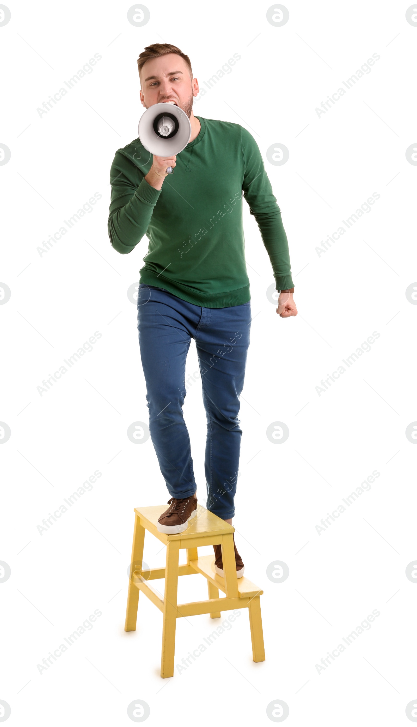 Photo of Young man shouting into megaphone on white background