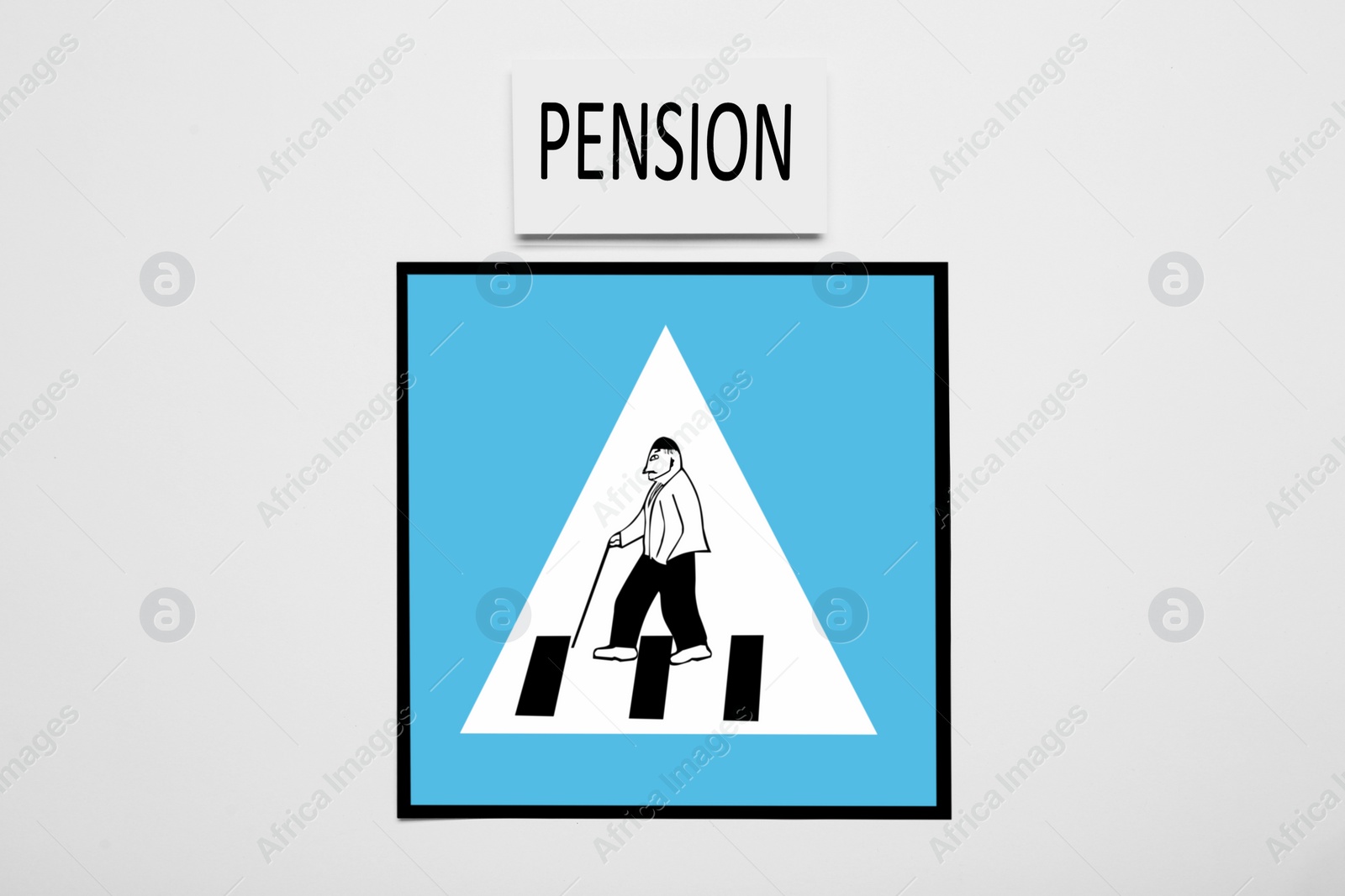 Photo of Card with word Pension and paper road sign for pedestrian crossing with elderly man on white background, top view