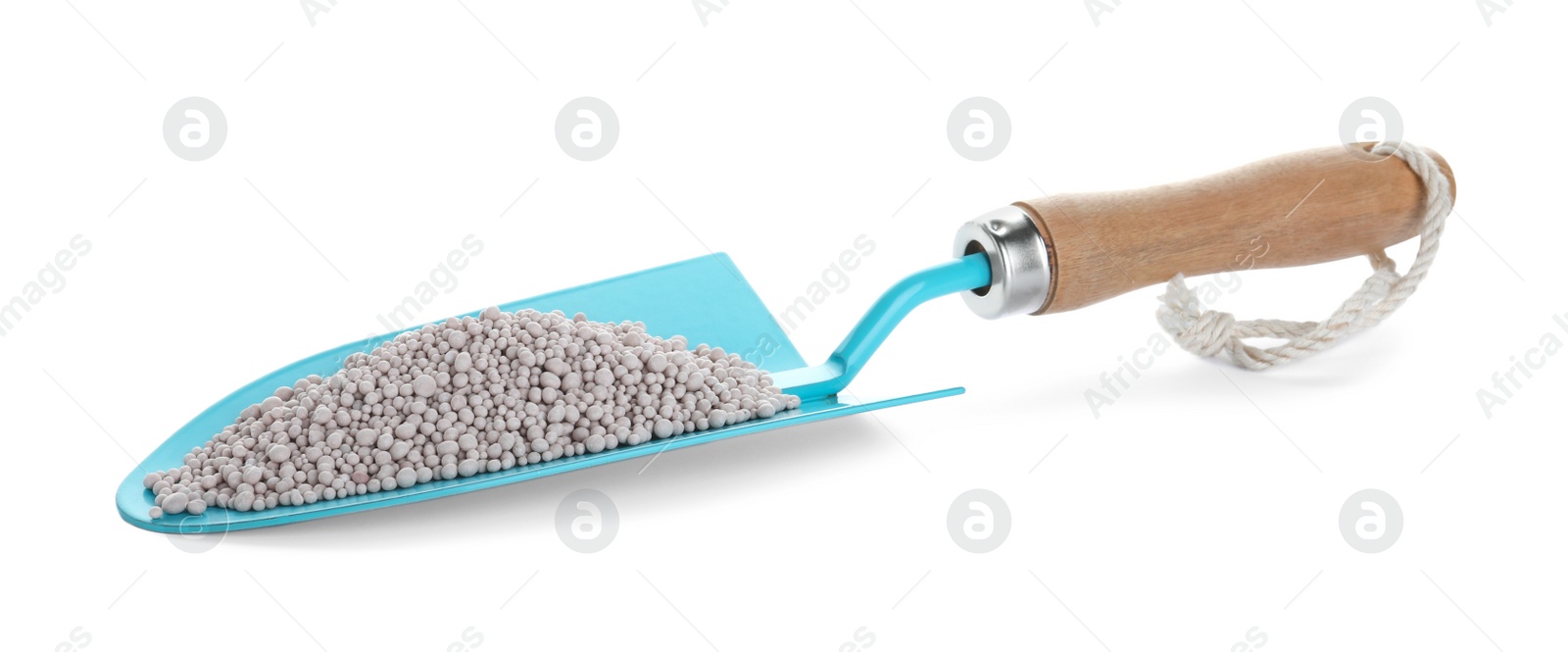 Photo of Shovel with chemical fertilizer isolated on white. Gardening time