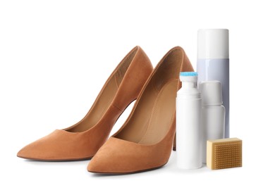 Stylish footwear with shoe care accessories on white background