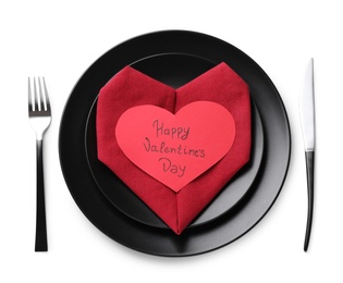 Elegant table setting with card on white background, top view. Valentine's Day celebration