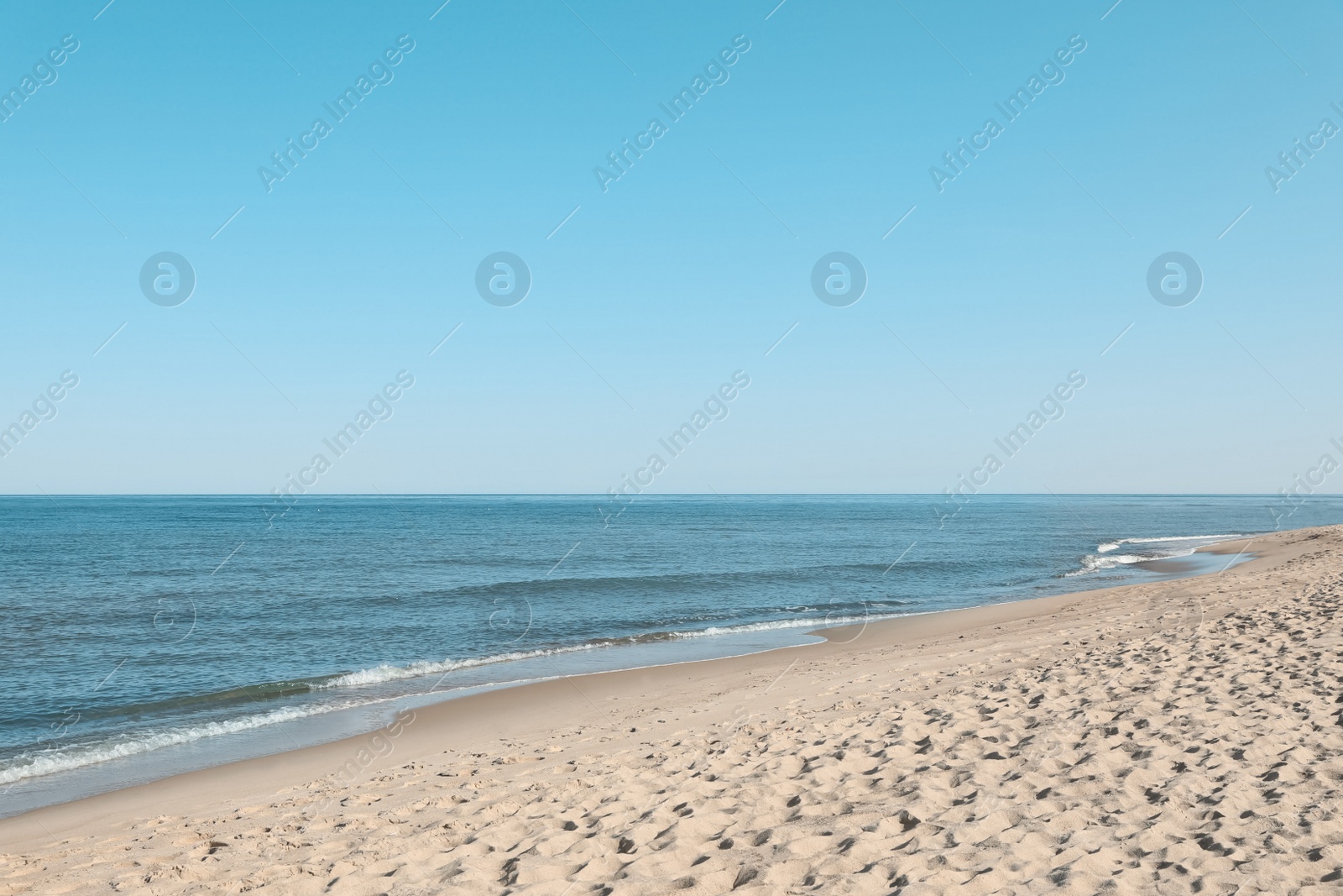 Photo of Picturesque view of sandy beach near sea