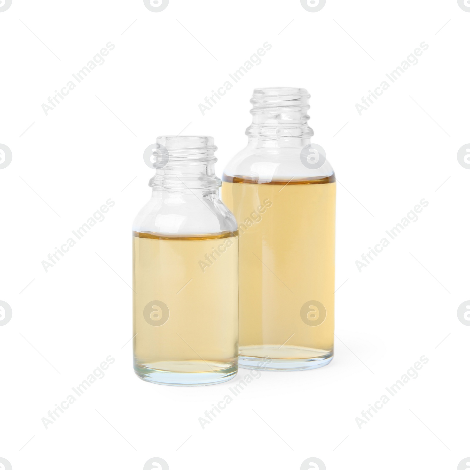 Photo of Glass bottles of essential oils on white background