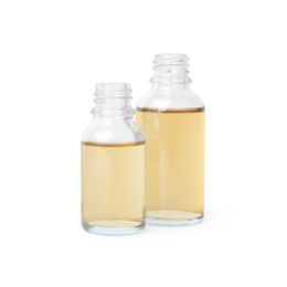 Photo of Glass bottles of essential oils on white background