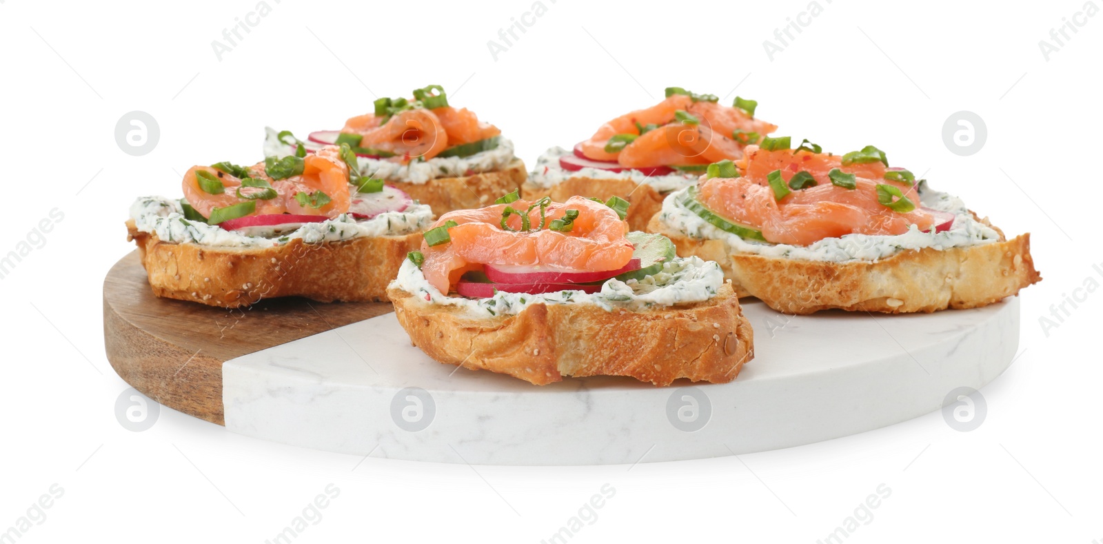 Photo of Tasty canapes with salmon, cucumber, radish and cream cheese isolated on white