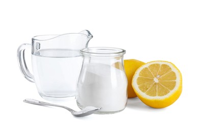 Photo of Baking soda in jar, vinegar and lemons isolated on white