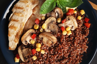 Photo of Plate with quinoa and garnish, top view