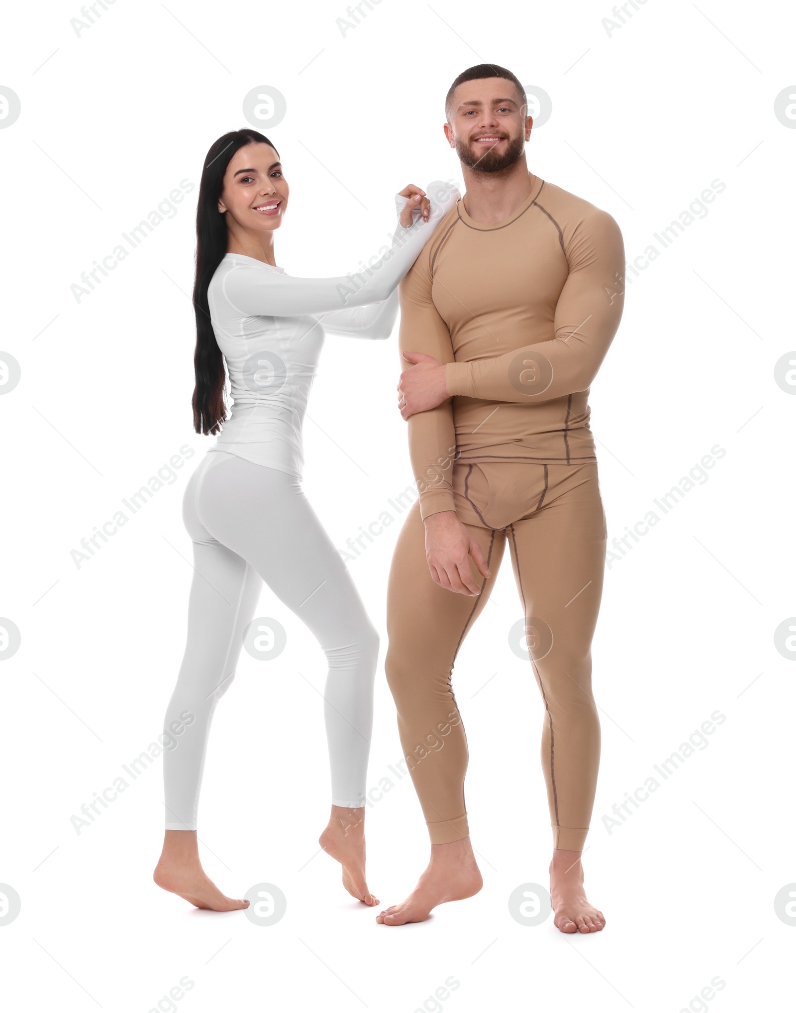 Photo of Man and woman in warm thermal underwear on white background