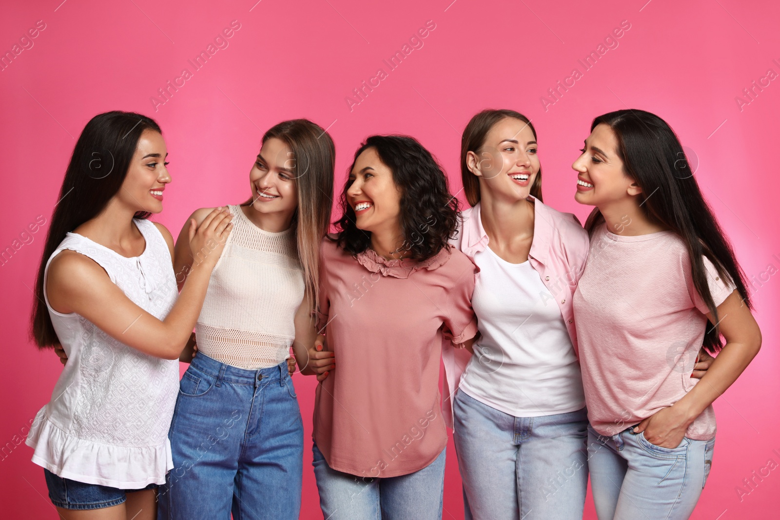 Photo of Happy women on pink background. Girl power concept